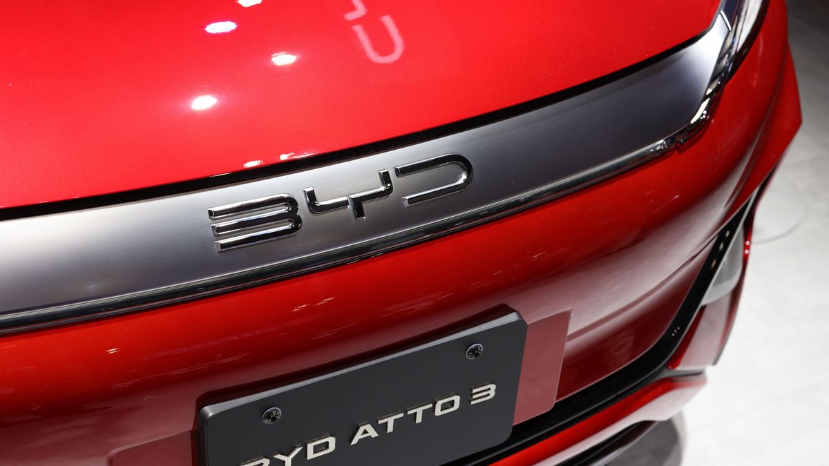 TOKYO, JAPAN - 2023/10/25: BYD logo on a bonnet of BYD ATTO 3 on display at the Japan Mobility Show 2023 in Tokyo Big Sight. The Japan Mobility Show 2023 is the biggest car exhibition event in Japan. It is held from October 28th to November 5th 2023. On October 25th and 26th, the international press received access to take a look at new car concepts and visions for the future of mobility in Japan and around the world. (Photo by Stanislav Kogiku/SOPA Images/LightRocket via Getty Images)