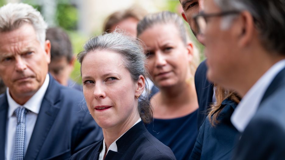 Lucie Castets, member of the New Popular Front, center, and other party representatives leave after talks with French President Emmanuel Macron, at the Elysee Palace in Paris, France, on Friday, Aug. 23, 2024. Macron is meeting with political parties and delegations after snap elections that left him weaker than before, with a hostile National Assembly that has no majority. Photographer: Benjamin Girette/Bloomberg via Getty Images