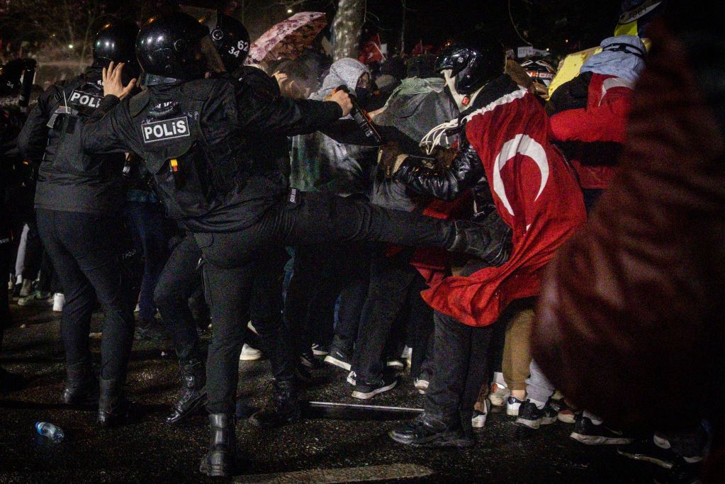 Istanbul Mayor Ekrem Imamoglu Charged With Corruption Amid Wave Of Protests
ISTANBUL, TURKEY - MARCH 23: A police officer kicks a protester during clashes in front of Istanbul's famous Aquaduct on March 23, 2025 in Istanbul, Turkey. The Mayor of Istanbul Ekrem Imamoglu, who was due to be selected as a presidential candidate for the opposition Republican People's Party (CHP) during a primary election today, was jailed on corruption charges following his detention earlier this week. He was among at least 100 politicians, business leaders and journalists detained as part of investigations into corruption and support for terrorism, according to Turkish authorities. Critics called the arrests politically motivated. (Photo by Chris McGrath/Getty Images)
Chris McGrath