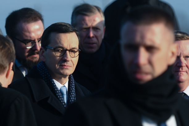 Mateusz Morawiecki (Center Left), Prime Minister of Poland, seen at the Monument to the Victims, inside the former Nazi German concentration and extermination camp Auschwitz II-Birkenau. 
On Friday, December 6, 2019, in Auschwitz Camp, Oswiecim, Poland. (Photo by Artur Widak/NurPhoto via Getty Images)
