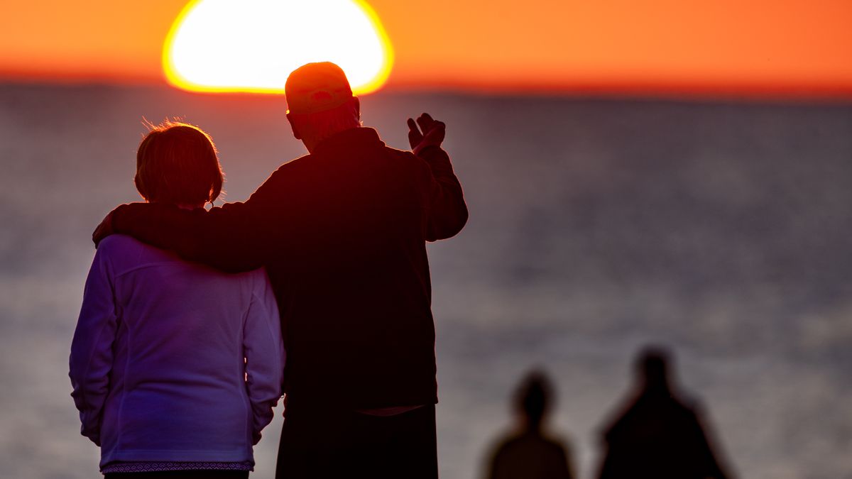 Nantucket, MA - September 12: People watch the sunset from Madaket Beach on September 12, 2025. (Photo by Stan Grossfeld/The Boston Globe via Getty Images)