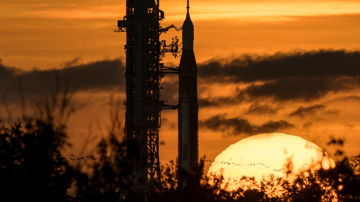 CAPE CANAVERAL, FLORIDA - AUGUST 31: In this handout image provided by NASA, NASA's Space Launch System (SLS) rocket with the Orion spacecraft aboard is seen during sunrise atop a mobile launcher at Launch Pad 39B as preparations for launch continue, at NASAs Kennedy Space Center, August 31, 2022 in Florida. NASAs Artemis I flight test is the first integrated test of the agencies deep space exploration systems: the Orion spacecraft, SLS rocket, and supporting ground systems.  (Photo by Bill Ingalls/NASA via Getty Images)