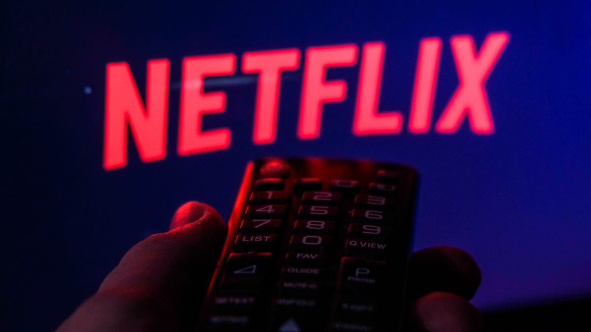 TV remote control is seen with Netflix logo displayed on a screen in this illustration photo taken in Krakow, Poland on February 6, 2022. (Photo by Jakub Porzycki/NurPhoto via Getty Images)