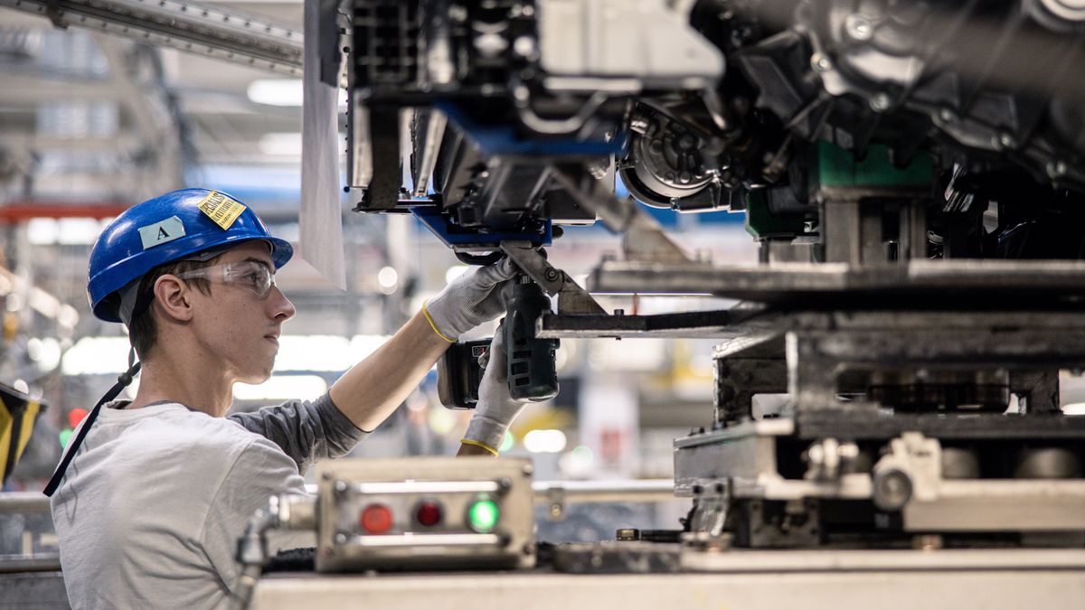 An employee installs components to the an automobile chassis on the assembly line inside the Suzuki Motor Corp. plant in Esztergom, Hungary, on Wednesday, Oct. 19, 2022. European automotive stocks gained a boost from figures showing that new car sales in the region rose for a second month in September as supply-chain issues eased. Photographer: Akos Stiller/Bloomberg via Getty Images