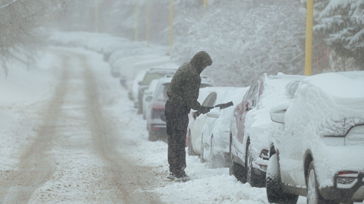 KOSICE, SLOVAKIA - JANUARY 2: Snowed-in cars park on the streets as heavy snowfall covers Kosice, the second biggest city of Slovakia as a result of industrial snowing caused by the nearby U.S. Steel plan't cooling towers, in Kosice, Slovakia on 2 January 2025. According to the Slovak Hydrometeorological Institute, due to the rare phenomenon, only the city faced heavy snowfall, the surrounding area and the villages and other cities didn't. (Photo by Robert Nemeti/Anadolu via Getty Images)