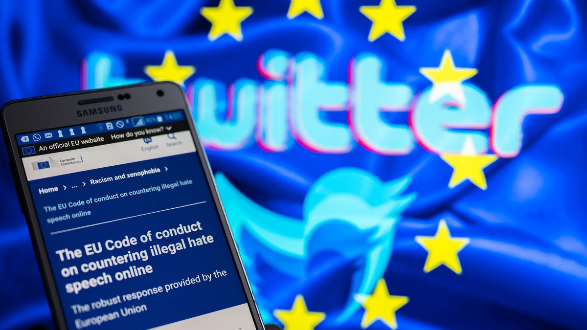 Twitter logo displayed on screen with EU code of conduct on countering illegal hate speech online, are seen in this illustration, in Brussels, Belgium, on November 27, 2022 (Photo illustration by Jonathan Raa/NurPhoto via Getty Images)