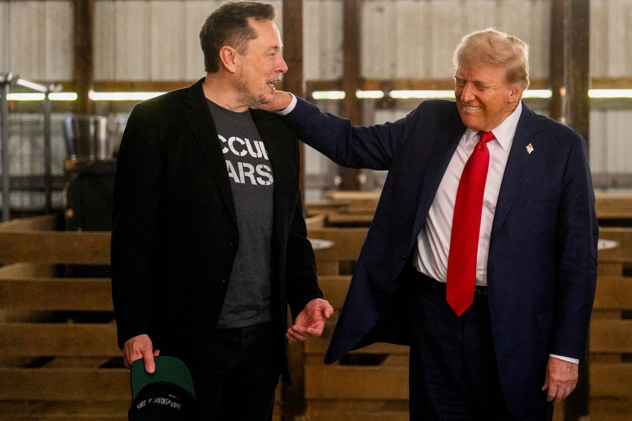 Elon Musk, chief executive officer of Tesla Inc., left, and former US President Donald Trump, prior to a campaign event at the Butler Farm Show in Butler, Pennsylvania, US, on Saturday, Oct. 5, 2024. Republican nominee Donald Trump rallied supporters at the site of a July assassination attempt, returning to the Pennsylvania venue where a gunman's bullet bloodied his ear and upended the presidential campaign. Photographer: Justin Merriman/Bloomberg via Getty Images