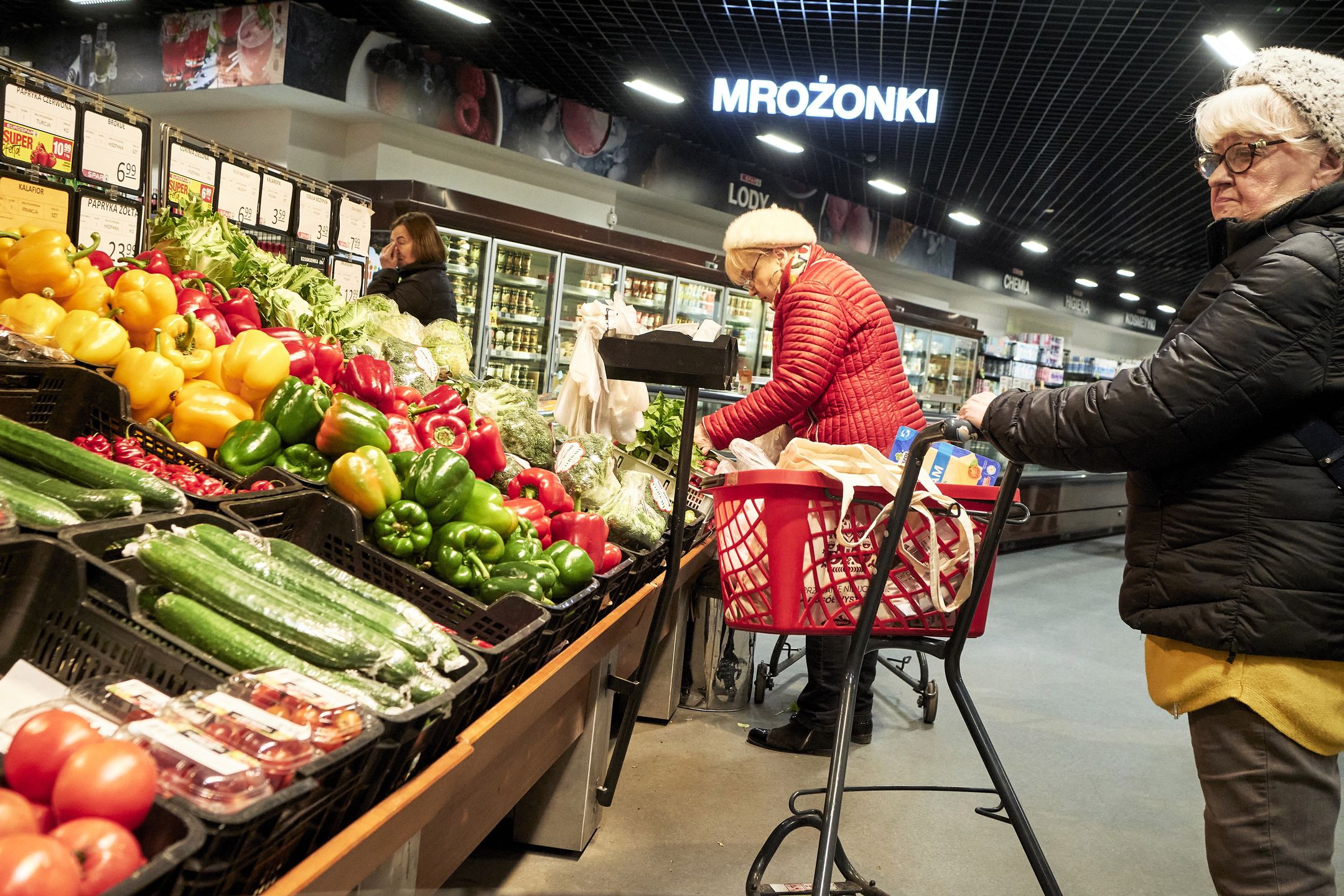 Customers shop for vegetables inside a Spar grocery store in Wroclaw, Poland, on Tuesday, March 5, 2024. The Polish national bank, also known as Narodowy Bank Polski (NBP), will announce rates on March 6. Photographer: Bartek Sadowski/Bloomberg via Getty Images