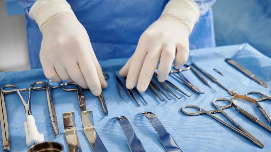 Doctor preparing instruments for plastic surgery in operating room.
Close up of plastic surgeon in sterile gloves getting ready medical instruments for operation. Doctor preparing scissors, forceps and scalpels for surgery. Concept of plastic surgery preparation.
operation, instrument, tool, surgery, plastic, medical, surgical, correction, medicine, procedure, doctor, surgeon, man, gloves, therapist, treatment, close up, beautician, physician, specialist, worker, person, hands, arm, professional, work, clinic, hospital, equipment, forceps, set, sterile, emergency, aesthetic, health, care, liposuction