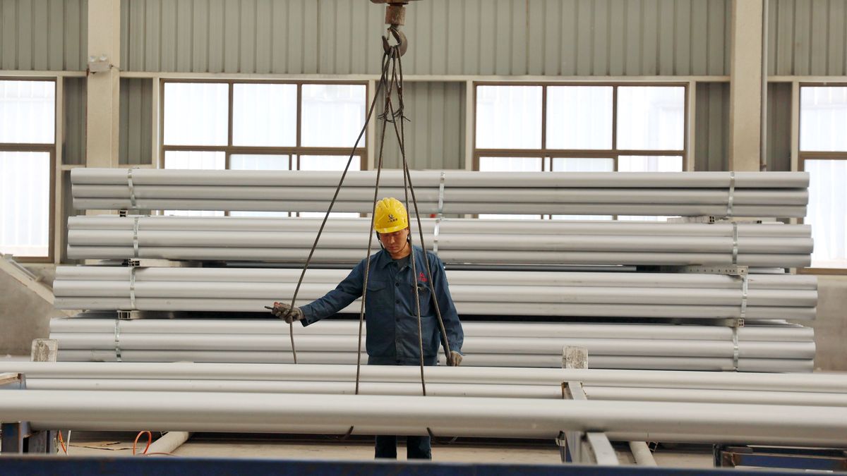BINZHOU, CHINA - MAY 13: A worker prepares to hoist aluminum alloy rods at the workshop of an aluminum product manufacturing enterprise on May 13, 2025 in Binzhou, Shandong Province of China. (Photo by Chu Baorui/VCG via Getty Images)