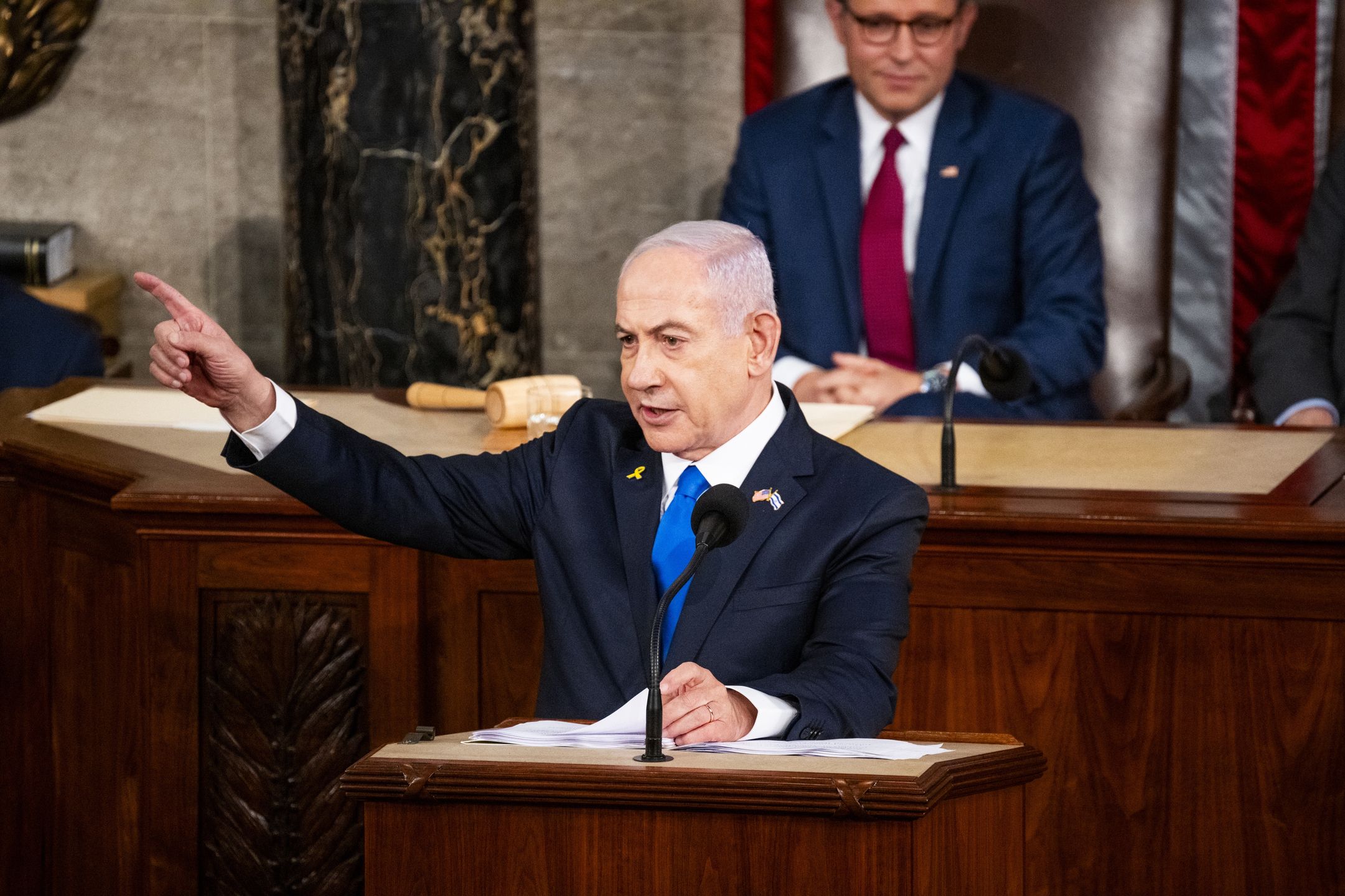WASHINGTON, DC - JULY 24: Prime Minister of Israel Benjamin Netanyahu addresses a joint meeting of Congress on July 24, 2024 in Washington, DC. House Speaker Mike Johnson looks on in the background. (Photo by Pete Kiehart for The Washington Post via Getty Images)