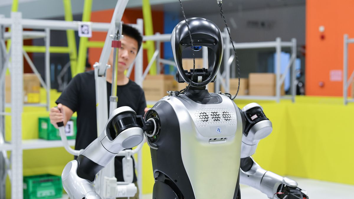 HEFEI, CHINA - AUGUST 23, 2025 - Contestants of the 27th China Robot and Artificial Intelligence Competition's Humanoid Robot Special Competition National Finals are practicing a humanoid robot in Hefei, Anhui Province, China on August 23, 2025. (Photo credit should read CFOTO/Future Publishing via Getty Images)