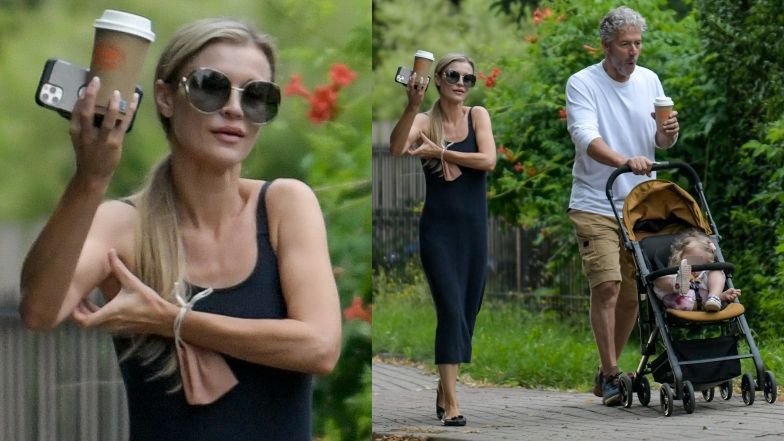 Joanna Krupa z kawą i smartfonem w ręce oprowadza męża i córeczkę po Warszawie