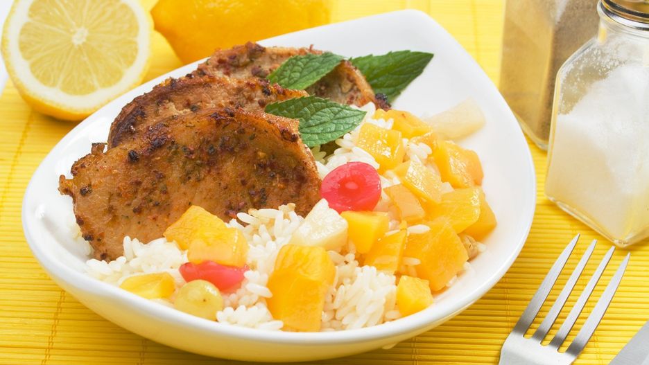 Pork loin chops with tropical fruit and cooked rice