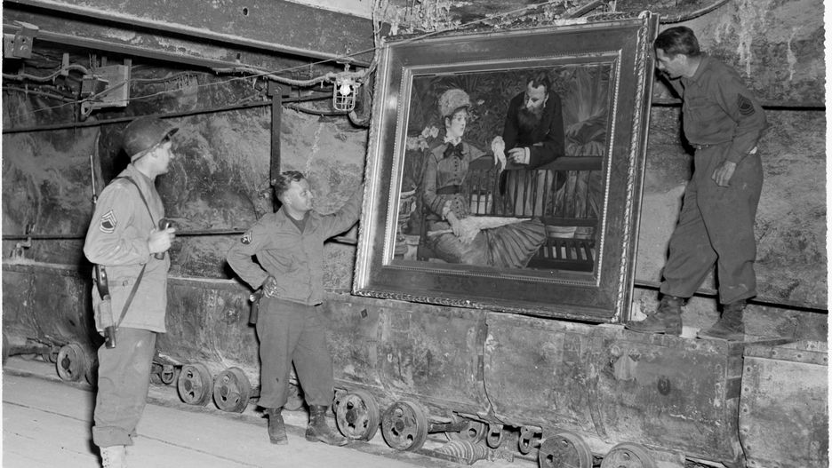 Merkers, Germany
U.S. Soldiers examine a famous painting, "Wintergarden," by the French Impressionist Edouard Manet, in the collection of Reichbank wealth, SS loot, and paintings removed by the Nazis from Berlin to a salt mine vault. The 90th Div, U.S. Third Army, discovered the gold and other treasure.
04/15/45
Photographer: Cpl. Ornitz
RG-111-SC-203453-5.tif