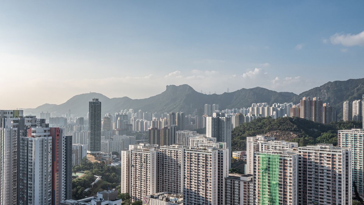 Lion Rock, center, overlooks residential buildings in the Kowloon area in Hong Kong, China, on Thursday, Nov. 4, 2021. With limited space to build, Hong Kong has gained a reputation for having some of the smallest and most expensive apartments anywhere in the world. Photographer: Lam Yik/Bloomberg via Getty Images