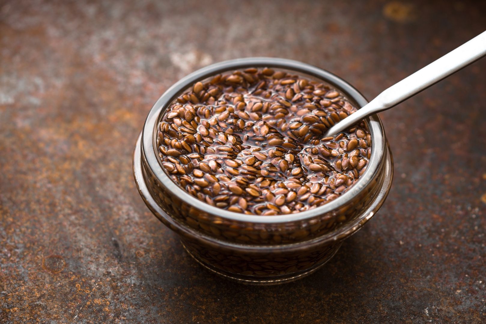Bowl with flax seeds in  water  on metal background horizontalGlass bowl with flax seeds in the water on the old metal background horizontalKarpenkovDenisVitamin, Flax Seed, Healthy Eating, Dieting, Vegetarian Food, Swollen, Raw Food, Drenched, Organic, Beige, Germinating, Cooking, Ingredient, Healthy Lifestyle, Backgrounds, Rusty, Preparation, Orange Color, Brown, Glass - Material, Metal, Old, Food And Drink, Horizontal, Seed, Cereal Plant, Plant, Water, Food, Bowl, Crockery, Spoon, Table, Vegan Food