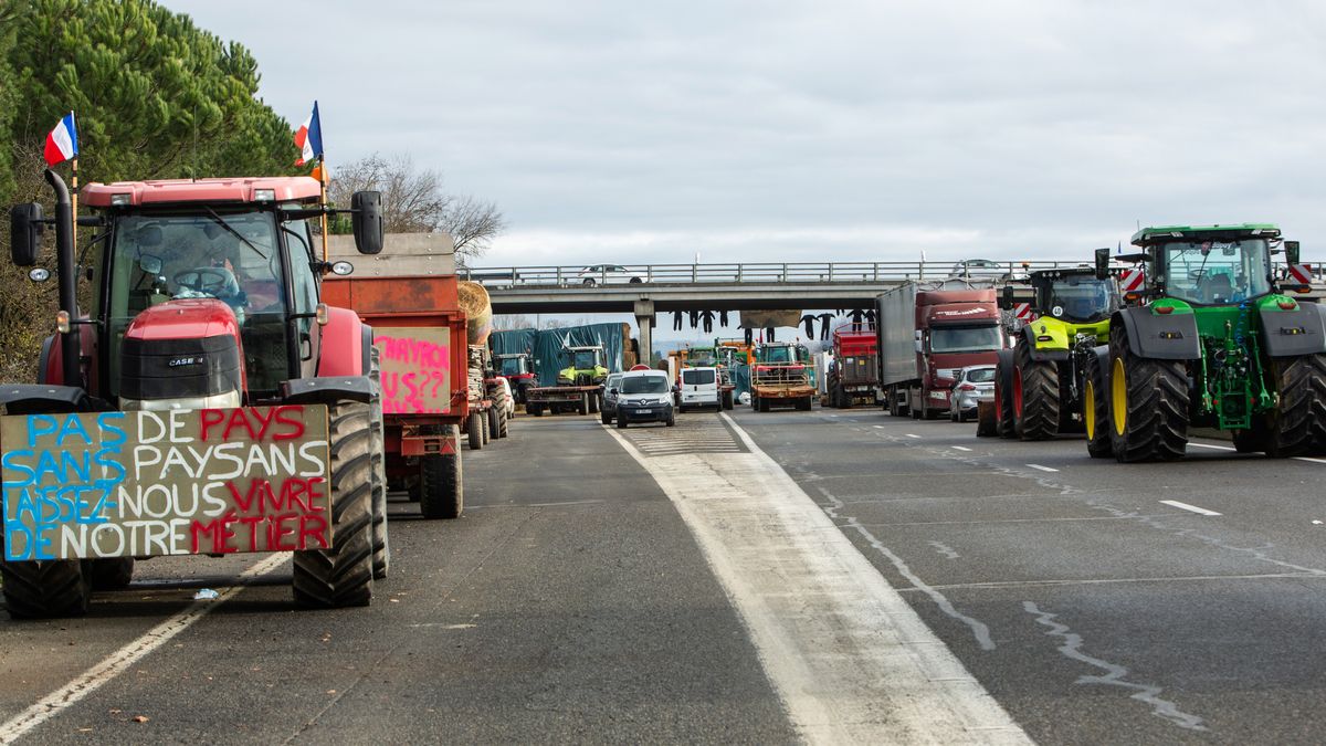 Tractors and farming vehicles block the A64 motorway during a protest by French farmers in Carbonne, France, on Wednesday, Jan. 24, 2024. France's farmers continued to block major roads across the country on Wednesday, demanding urgent action from President Emmanuel Macron's government to cut back costs and burdensome regulation. Photographer: Matthieu Rondel/Bloomberg via Getty Images