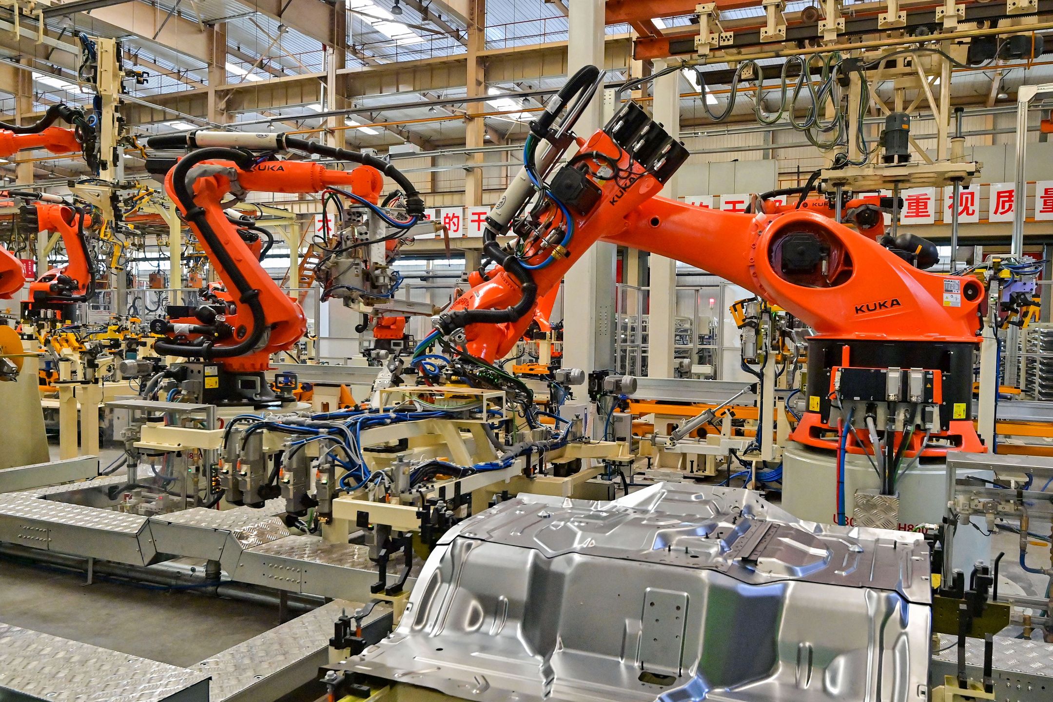 QINGZHOU, CHINA - MAY 31, 2022 - Robots are produced at a workshop of an automobile manufacturer in Qingzhou city, East China's Shandong Province, May 31, 2022. China's manufacturing purchasing managers' index (PMI) rose 2.2 percentage points from the previous month to 49.6 percent in May, according to the Service Industry Survey Center of the National Bureau of Statistics and the China Federation of Logistics and Purchasing. (Photo credit should read CFOTO/Future Publishing via Getty Images)