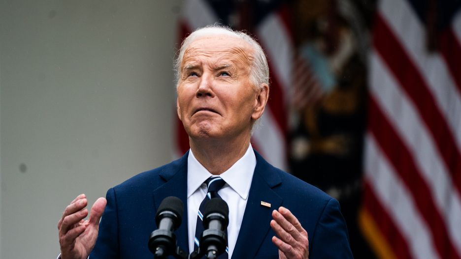 WASHINGTON, DC  May 14, 2024:

US President Joe Biden looks up at the rain during his remarks during an event to promote American investments and jobs in the Rose Garden of the White House on Tuesday May 14, 2024.
(Photo by Demetrius Freeman/The Washington Post via Getty Images)