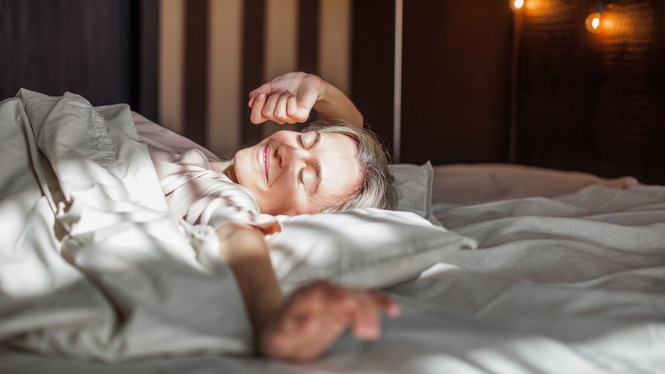 Good morning. Middle aged beautiful relaxed female with closed eyes in pajamas waking up in her bed fully rested, happy woman stretching after night sleep
woman, bed, bedroom, stretching, morning, middle aged, smile, comfort, home, blonde, apartment, rest, sleepy, sleep, day, people, female, 40s, comfortable, relaxation, beautiful, wake up, happy, mature, lying down, wall, adult, arms, indoor, background, light, middle-aged, lifestyle, fun, wake-up, comfy bedroom, home relaxation, lay bedtime, female pleasure, relax sunday, calm peace, cozy apartment, overjoyed woman, lady stretch, good weekend, sun, laziness, relax, get up early