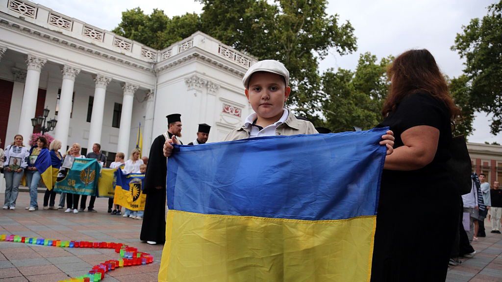 A boy holds a Ukrainian flag during an action at Birzhevaya
ODESSA, UKRAINE - 2025/08/23: A boy holds a Ukrainian flag during an action at Birzhevaya Square. On the Day of the National Flag of Ukraine, activists held an action "Action in Memory of Great Heroes" at Birzhevaya Square. The purpose of the action is to remember all those who died in the Russian-Ukrainian war under the flag of Ukraine. 23 August is celebrated as the Day of the National Flag of Ukraine since in 2004. (Photo by Viacheslav Onyshchenko/SOPA Images/LightRocket via Getty Images)
SOPA Images
memory, birzhevaya square, russian-ukrainian war, activists, commemoration, remembrance, great heroes, day of the national flag of ukraine