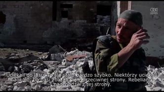 Prorosyjscy bojownicy sprawdzają szkody wyrządzone przez walki w niewielkim mieście koło Ługańska