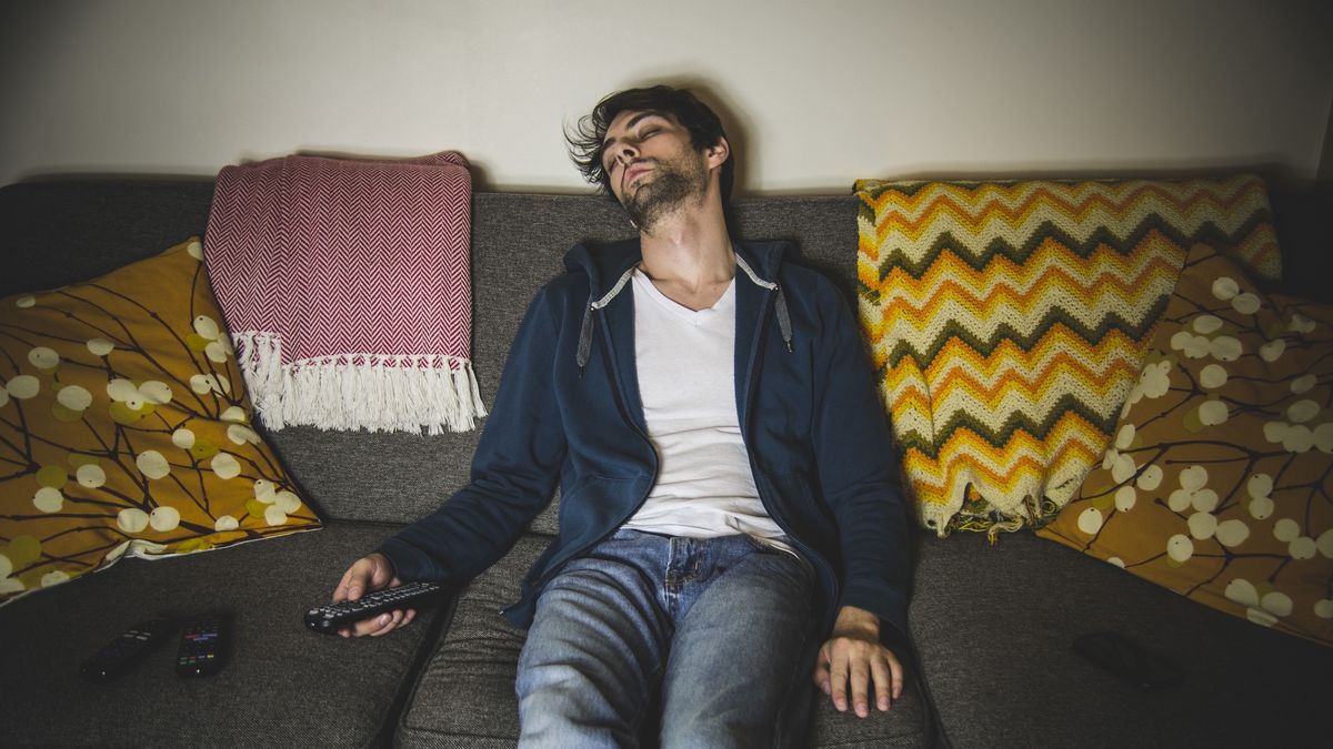 Young Adult Man Sleeping on Couch with TV Remote in HandGlasshouse Imagesone person:CB2, beards:CB2, 30-34 years:CB2, young adult man:CB2, sleeping:CB2, recreation:CB2, Caucasian ethnicity:CB2, remote control:CB2, eyeglasses:CB2, indoors:CB2, exhausted:CB2, sofa:CB2, T-shirt:CB2, technology:CB2, television:CB1, dark hair:CB2, 33 years:CB2, tv:CB1, sweat jacket:CB2