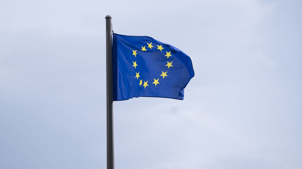 A European Union (EU) flag flies near the National Assembly building in Paris, France, on Tuesday, July 9, 2024. The legislative election vote created a complex split in the National Assembly, which opens the door to unprecedented deal-making to form a ruling coalition. Photographer: Nathan Laine/Bloomberg via Getty Images