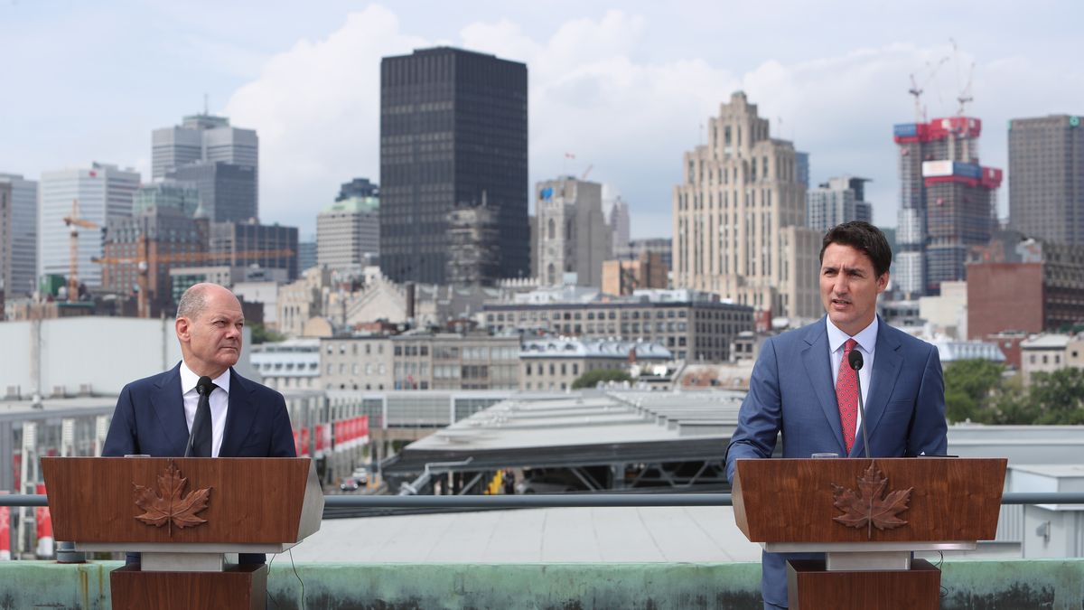 Olaf Scholz, Germany's chancellor, left, and Justin Trudeau, Canada's prime minister, speak during a news conference in Montreal, Quebec, Canada, on Monday, Aug. 22, 2022. Trudeau said Canada is potentially willing to ease regulatory hurdles for building infrastructure to export liquefied natural gas to Germany, but only if it makes economic sense to do so. Photographer: David Kawai/Bloomberg via Getty Images