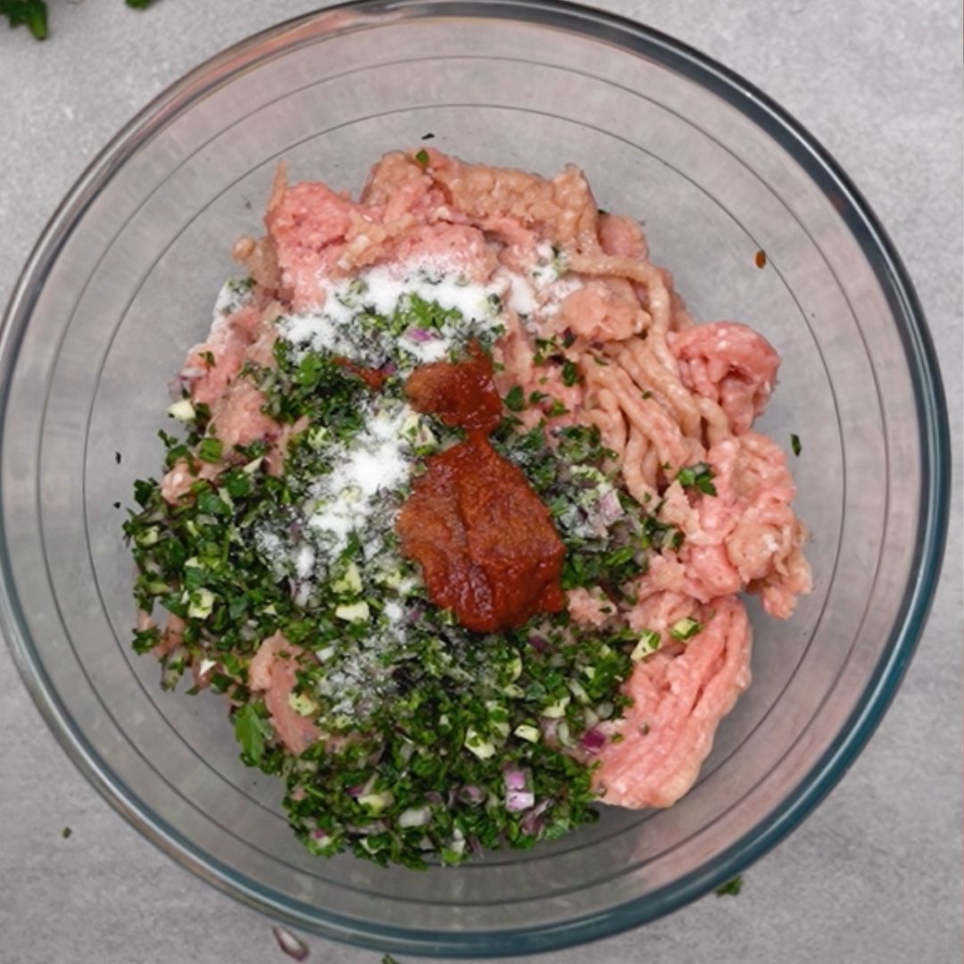 Into the bowl, I throw, among other things, tomato paste.