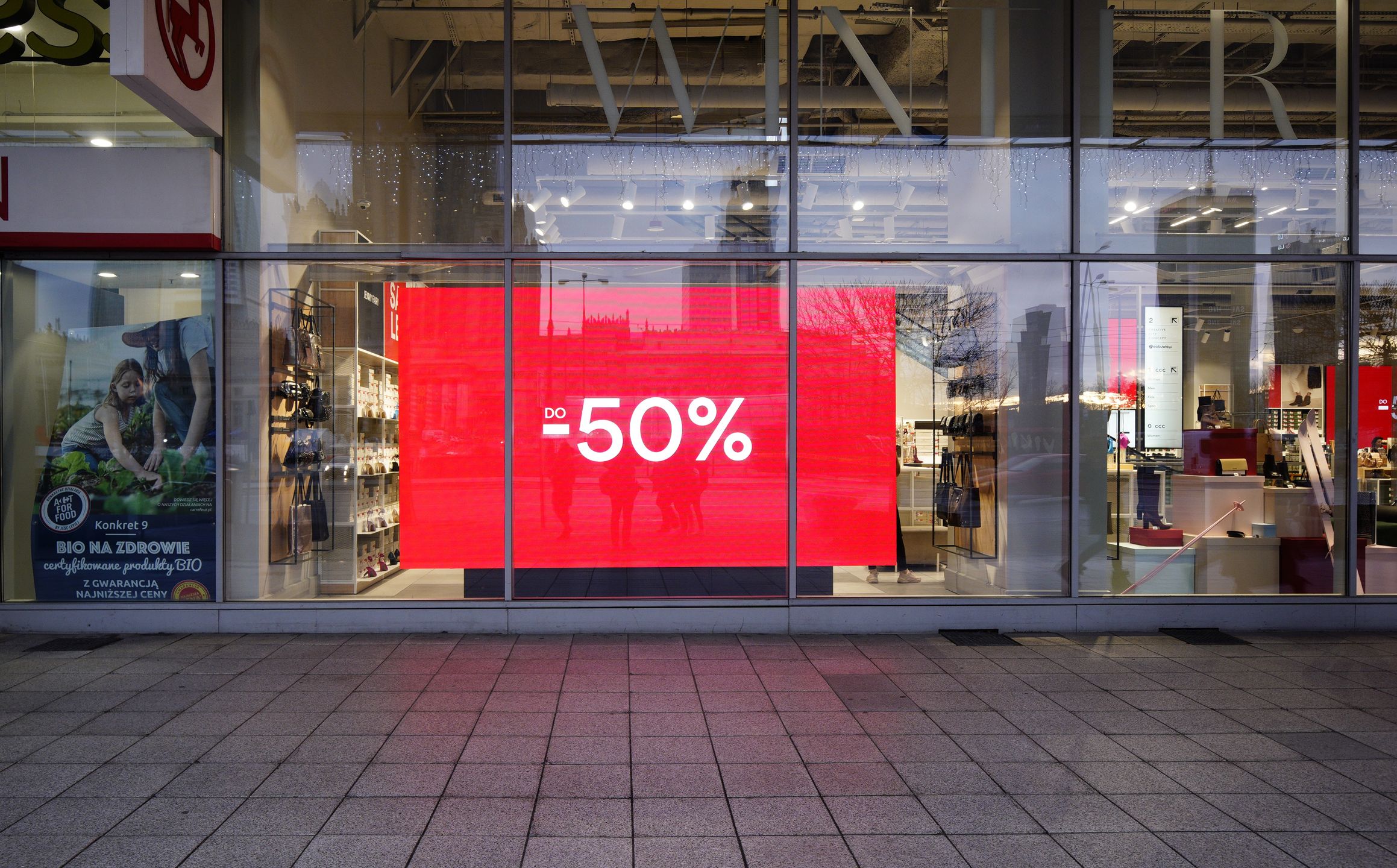 A sign in a closed shop is seen advertising a 50 percent off sale in Warsaw, Poland on December 29, 2020. (Photo by Jaap Arriens/NurPhoto via Getty Images)