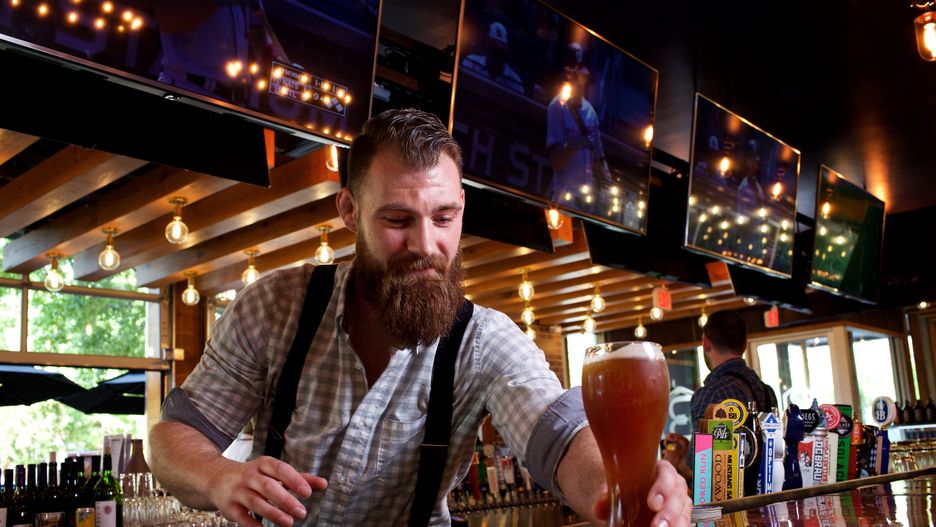 ARLINGTON, VA - SEPTEMBER 18, 2019:  Bartender Jake Fahlfeder with a glass of beer at Bronson Bier Hall photographed in Arlington, VA on September 18, 2019. (Photo by Deb Lindsey for The Washington Post via Getty Images).