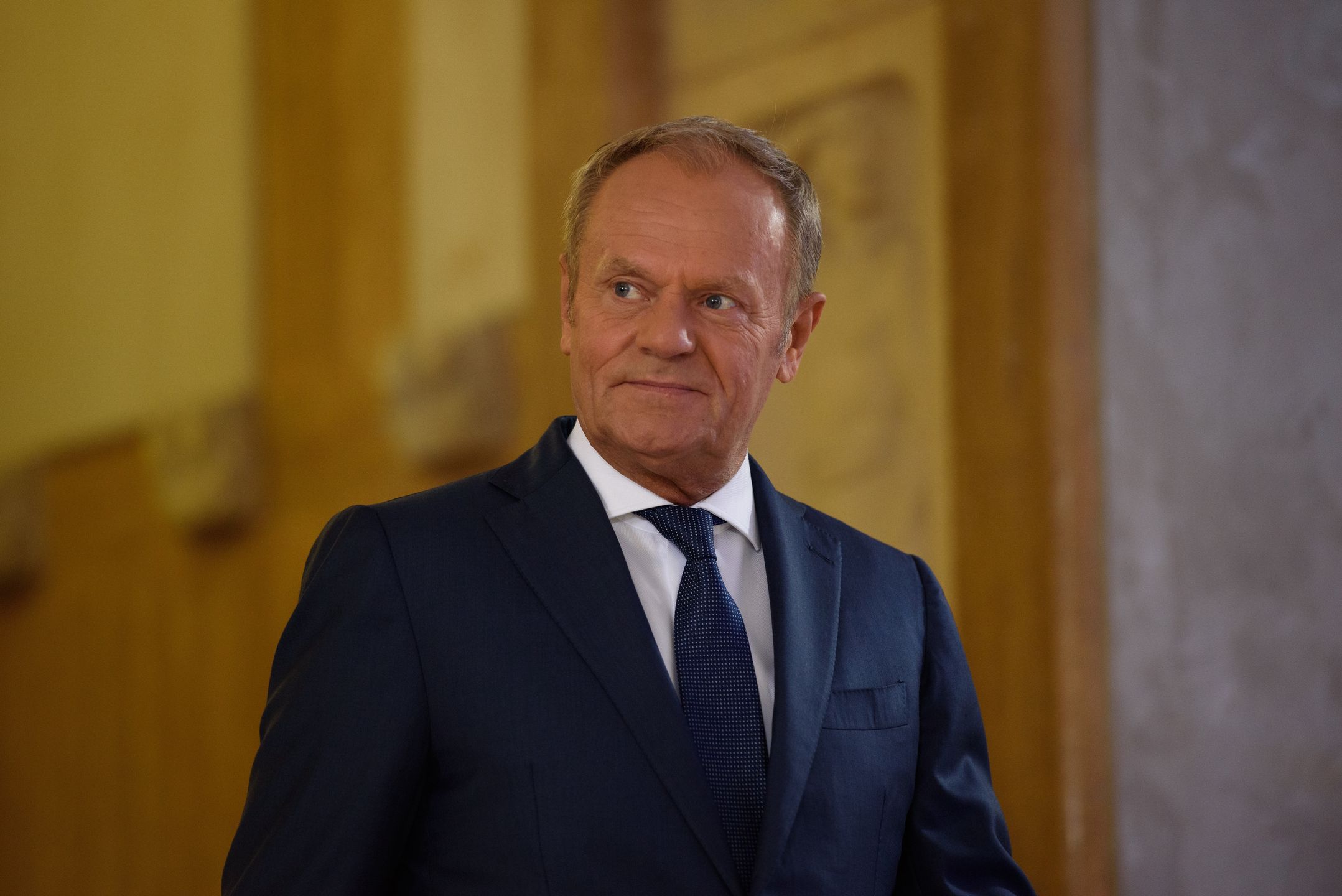 Polish Prime Minister Donald Tusk is looking on as he is arriving before meeting with Slovakia's President Peter Pellegrini during a bilateral meeting in Warsaw, Poland, on July 4, 2024. (Photo by Aleksander Kalka/NurPhoto via Getty Images)