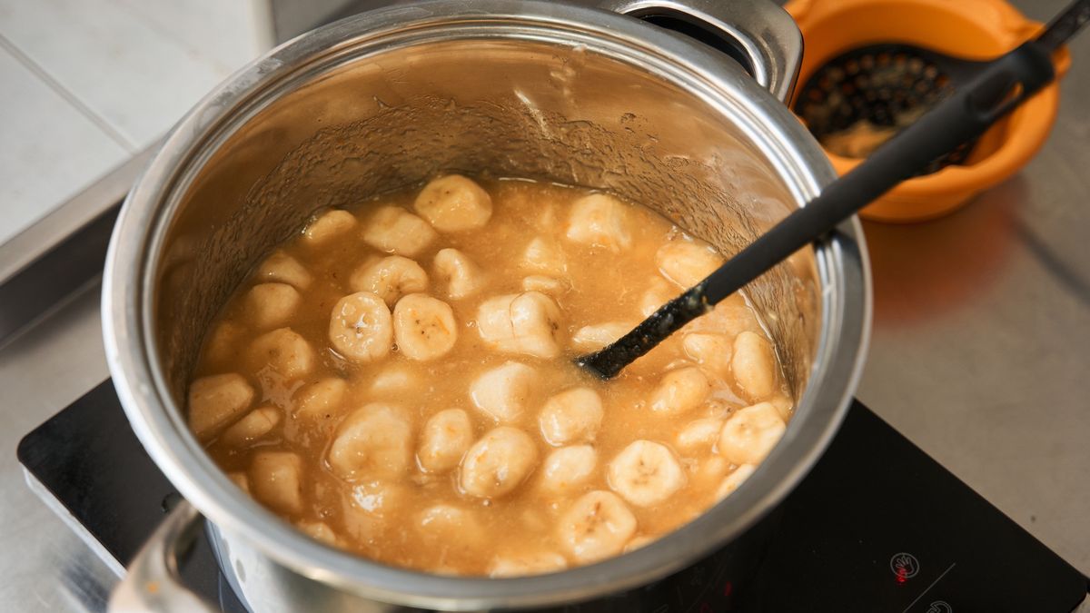 Banana mousse at pan standing at the stove and preparing for the future cakes
Close up view of the banana mousse at the pan standing at the stove and preparing for the future cakes at the industrial kitchen. Culinary concept. Stock photo
YakobchukOlena
