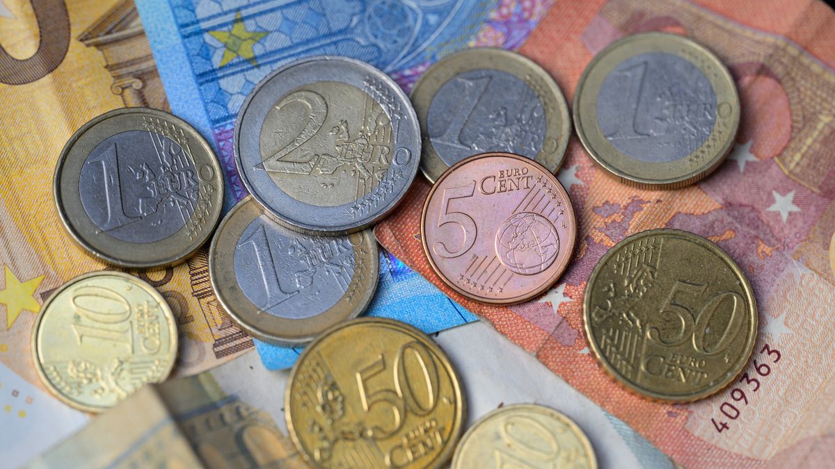 Euro banknotes and coins are lying on a table in this photo illustration taken in Brussels, Belgium, on January 1, 2024. The Euro came into effect 25 years ago on January 1, 1999. (Photo by Jonathan Raa/NurPhoto via Getty Images)