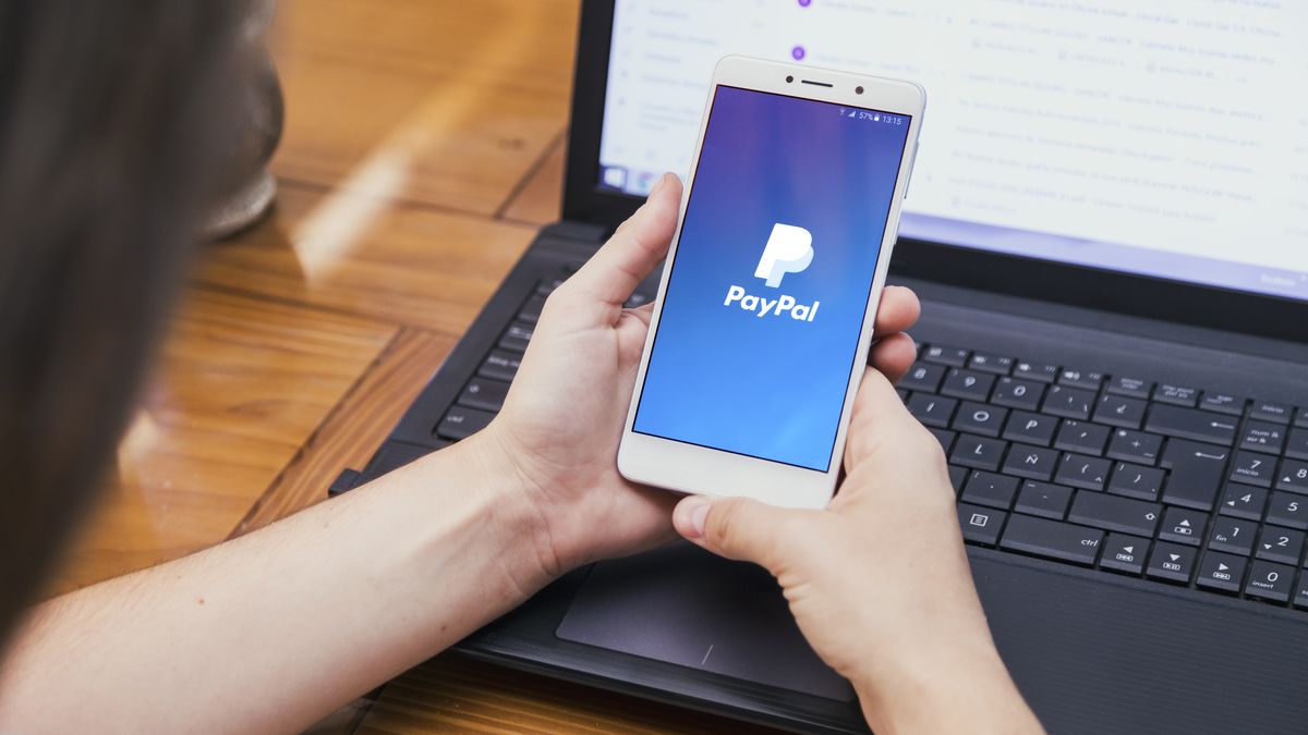 ROSARIO, ARGENTINA - FEBRUARY 16, 2019: Paypal app on the screen of smartphone.Girl in front of a laptop with cell phone in her hands. Logotype of electronic payment system. Millennial,Technology.hand, editorial, computer, apple, illustrative, modern, holding, app, application, business, commercial, device, digital, display, electronic, girl, illustrative editorial, internet, laptop, lifestyle, millennial, mobile, network, online, phone, photo, screen, smart, smartphone, table, tech, technology, touch, using, watch, web, wireless, woman, young, pay, payment, paying, paypal, money, blue, logo, logotype, businesswoman, home, gadget, paypal, online, payment, business, phone, app, commercial, money, pay, paying, web, logo, internet, smartphone, hand, editorial, computer, apple, illustrative, modern, holding, application, device, digital, display, electronic, girl, illustrative editorial, laptop, lifestyle, millennial, mobile, network, photo, screen, smart, table, tech, technology, touch, using, watch, wireless, woman, young, blue, logotype, businesswoman, home, gadget