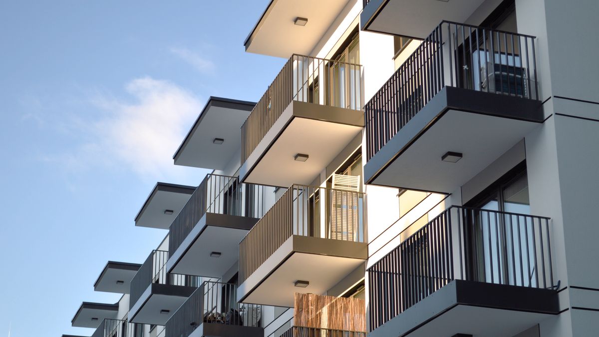 Exterior view of a contemporary multi-story residential housing complex in Warsaw with geometric balconies. The bright sun illuminates the white facade against a clear blue sky. This image represents urban living, real estate development, and financial investments in modern property.warsaw, poland, apartment, building, architecture, residential, house, modern, balcony, exterior, facade, city, urban, design, sky, blue, real, estate, property, investment, mortgage, loan, credit, home, flat, block, construction, sunny, window, luxury, structure, living, neighborhood, street, development, contemporary, concrete, white, glass, skyward, perspective, morning, finance, buy, sell, dwelling, terrace, railing, geometrical, polish, warsaw, poland, apartment, building, architecture, residential, house, modern, balcony, exterior, facade, city, urban, design, sky, blue, real, estate, property, investment, mortgage, loan, credit, home, flat, block, construction, sunny, window, luxury, structure, living, neighborhood, street, development, contemporary, concrete, white, glass, skyward, perspective, morning, finance, buy, sell, dwelling, terrace, railing, geometrical
