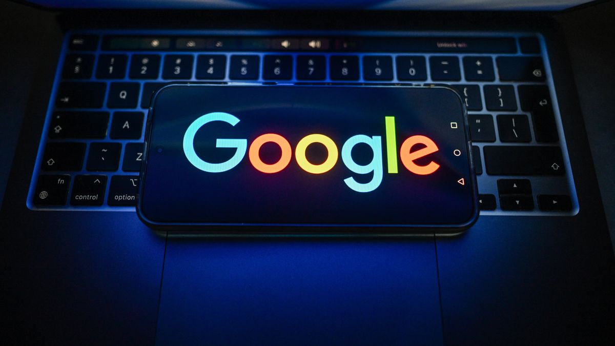 POLAND - 2026/07/15: In this photo illustration, a Google logo is seen displayed on a smartphone on the top of a laptop. (Photo Illustration by Omar Marques/SOPA Images/LightRocket via Getty Images)