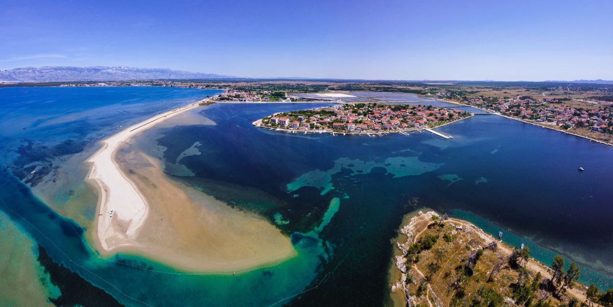 The Old Town is located on an island from which a sandy lagoon can be seen.