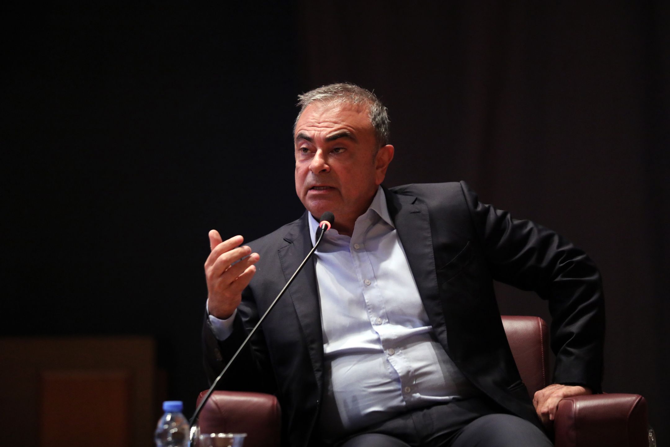 Carlos Ghosn, former Nissan chief executive officer, speaks at a roundtable event at St Joseph University in Beirut, Lebanon, on Thursday, Oct. 28, 2021. Nissan Motor Co. agreed to settle a class action by investors who said they were misled about a compensation plan that allegedly saw former chairman Carlos Ghosn overpaid, according to a court filing earlier this month. Photographer: Hasan Shaaban/Bloomberg via Getty Images