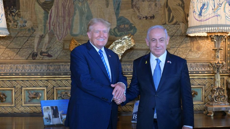 PALM BEACH, FLORIDA - JULY 26: (----EDITORIAL USE ONLY - MANDATORY CREDIT - 'AMOS BEN-GERSHOM / GPO / HANDOUT' - NO MARKETING NO ADVERTISING CAMPAIGNS - DISTRIBUTED AS A SERVICE TO CLIENTS----) Former US President Donald Trump (L) shakes hands with Israeli Prime Minister Benjamin Netanyahu (R) as they pose for a photo within their meeting at Mar-a-Lago estate, in Palm Beach, Florida, United States on July 26, 2024. (Photo by Amos Ben-Gershom (GPO) / Handout/Anadolu via Getty Images)