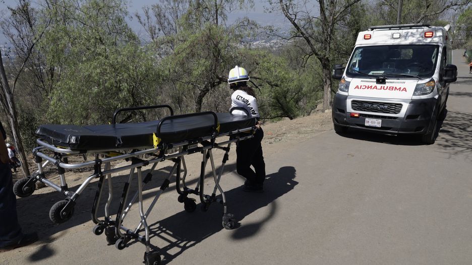 Members of Civil Protection are rescuing a person who suffered a fall while climbing Cerro de la Estrella in the Iztapalapa mayor's office in Mexico City. The individual has sustained a fractured tibia and fibula. The Civil Protection team is currently descending with a stretcher to immobilize the injured person and transport them to an ambulance, which will then take them to a nearby hospital. (Photo by Gerardo Vieyra/NurPhoto via Getty Images)