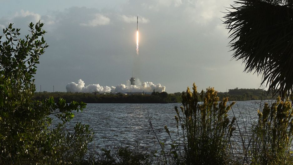 A SpaceX Falcon 9 rocket carrying the 14th batch of 60 Starlink internet satellites launches from pad 39A at the Kennedy Space Center on October 18, 2020 in Cape Canaveral, Florida. After launch, the first stage booster rocket was recovered by SpaceX on a drone ship in the Atlantic Ocean. (Photo by Paul Hennessy/NurPhoto via Getty Images)