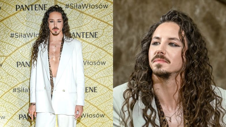 Michał Szpak w białym garniturze świeci nagim torsem