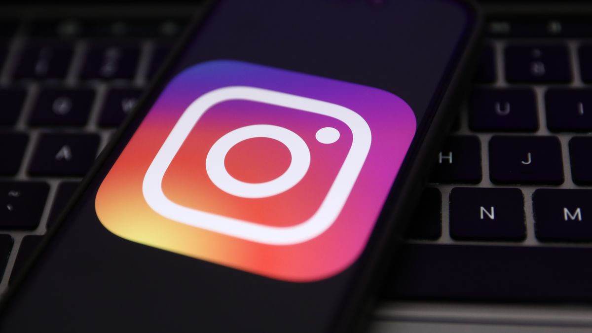 A laptop keyboard and Instagram logo displayed on a phone screen are seen in this illustration photo taken in Krakow, Poland on February 7, 2024. (Photo by Jakub Porzycki/NurPhoto via Getty Images)