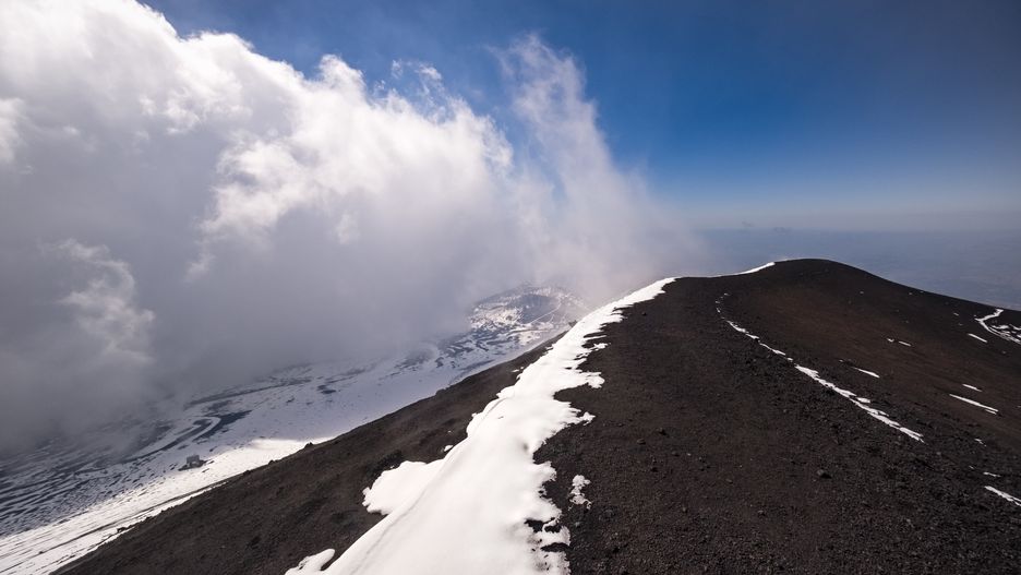 CATANIA, SICILY, ITALY - 2022/05/02: Thick clouds are moving toward the craters of Mount Etna, Mongibello, at more than 3350 m the highest volcano in Europe. (Photo by Frank Bienewald/LightRocket via Getty Images)