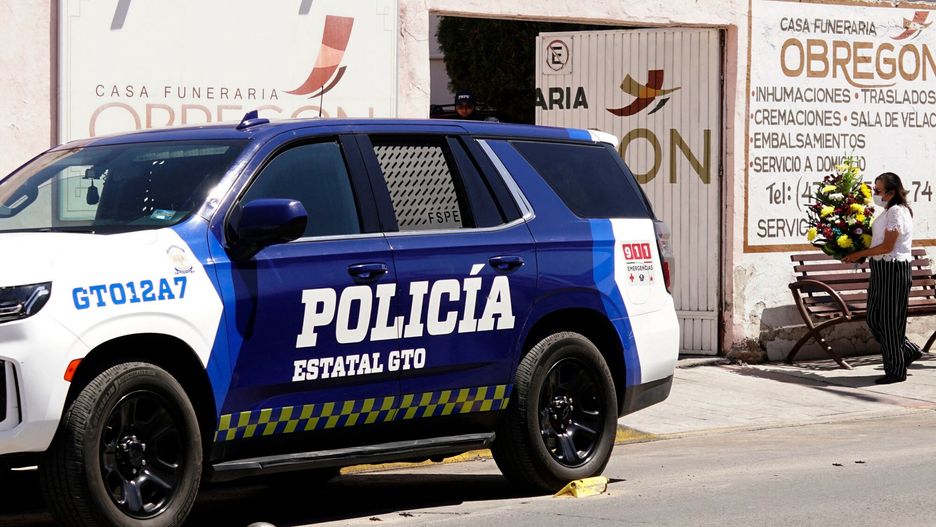 Temporary
A Guanajuato state police patrol vehicle guards the funeral of journalist Kristian Zavala, who was shot dead along with another person early Sunday morning, in the municipality of Silao, Guanajuato State, Mexico, on March 3, 2025. Journalist Kristian Uriel Martinez Zavala, who ran a Facebook news page, was murdered in the early hours of March 2 in the central Mexican state of Guanajuato, local authorities reported. (Photo by Mario ARMAS / AFP)
MARIO ARMAS