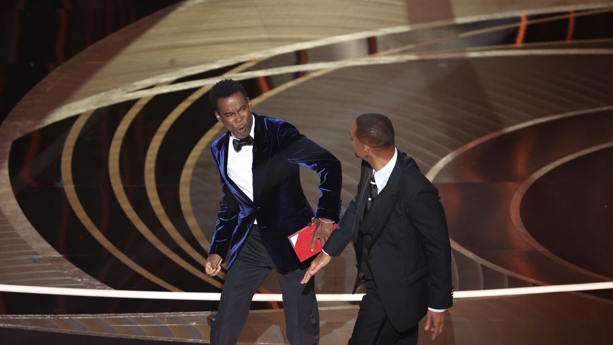 HOLLYWOOD, CA - March 27, 2022.    Chris Rock and Will Smith onstage during the show  at the 94th Academy Awards at the Dolby Theatre at Ovation Hollywood on Sunday, March 27, 2022.  (Myung Chun / Los Angeles Times via Getty Images)
