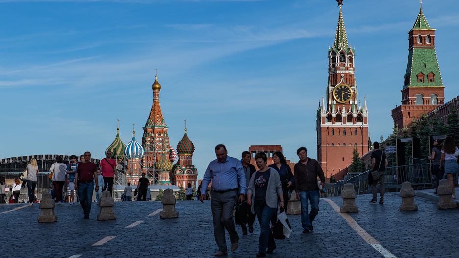 People walking on Red Square (Saint Basil's Cathedral and Kremlin clock tower are visible on background) are seen in Red Square in Moscow, Russia, on May 19, 2019. (Photo by Lorenzo Di Cola/NurPhoto via Getty Images)